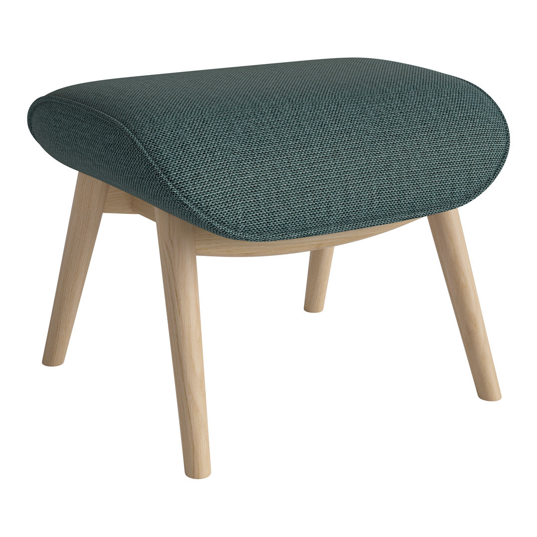 Teal patterned upholstery on a rounded ottoman with light wooden legs, adding a modern touch to any space.