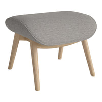 Gray upholstered ottoman with a textured surface and natural wooden legs. Ideal for modern decor.