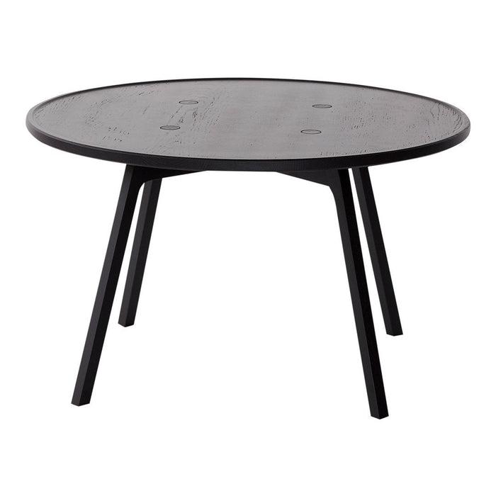 Round black coffee table with a smooth surface and sleek, minimalist design, perfect for modern decor.