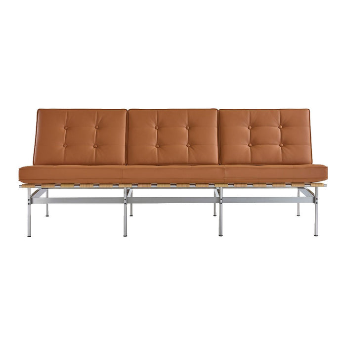 Brown tufted leather sofa with a sleek chrome base and minimalist design. Perfect for modern interiors.