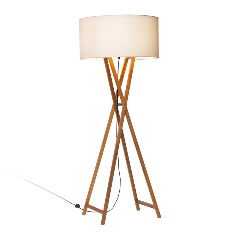 Wooden tripod floor lamp with a round, white fabric shade, showcasing a modern, minimalist design.