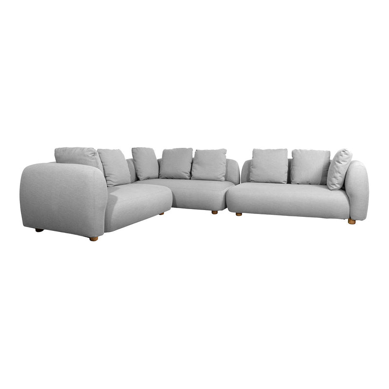 Gray sectional sofa with plush cushions and smooth fabric, featuring simple lines and a modern design.