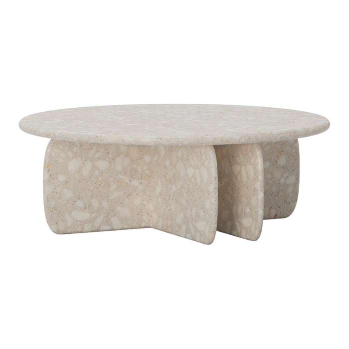 Round beige coffee table with a textured, speckled surface and a unique three-legged design. Perfect for modern decor.
