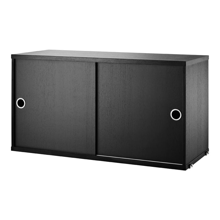 "Modern black storage cabinet with sleek sliding doors and circular handles, perfect for minimalist decor."