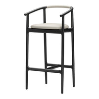 Black bar stool with minimalist design and cream-colored seat cushion, featuring a textured handle for added grip.