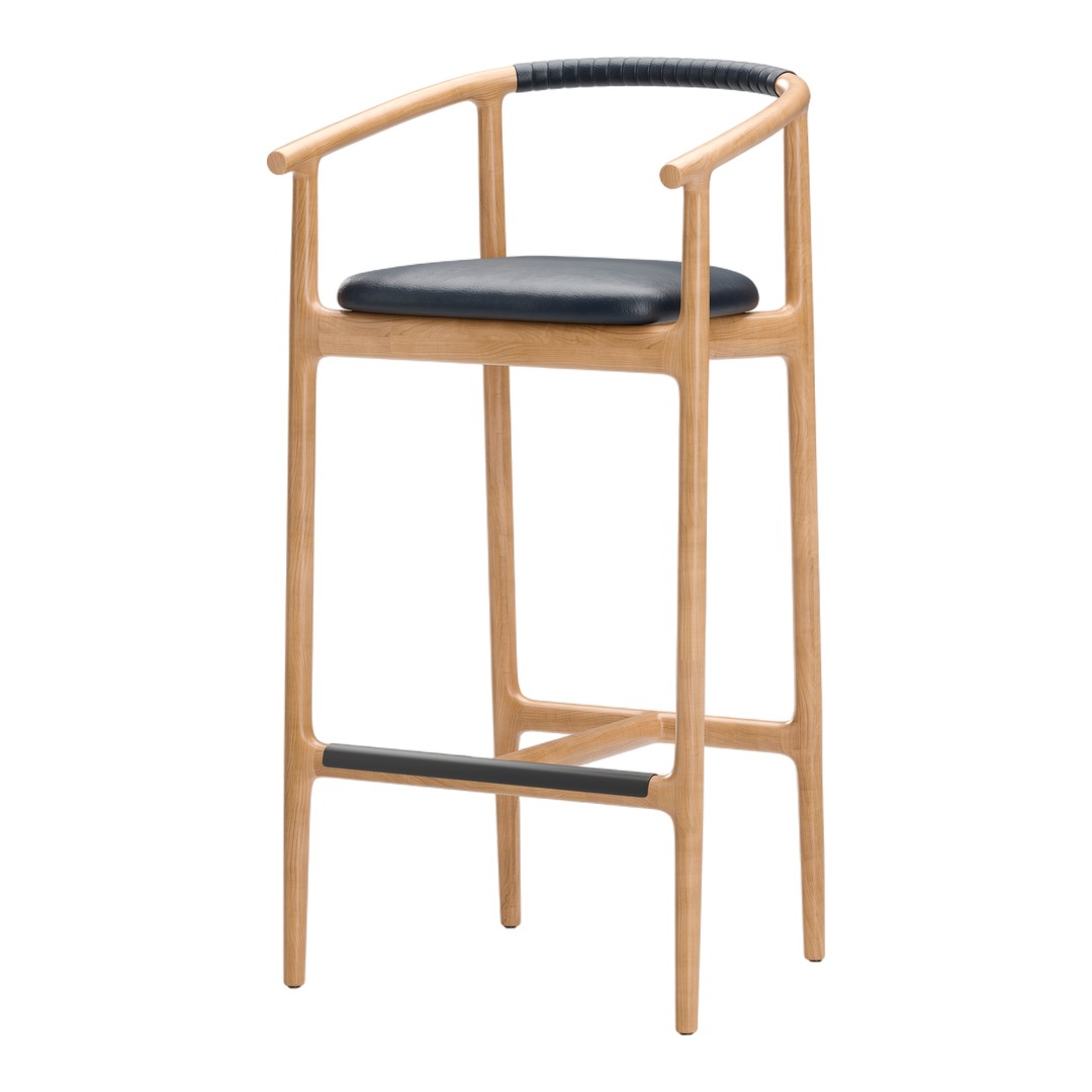 Light wood bar stool with a sleek black leather seat and black woven detail on the armrest, minimalistic design.