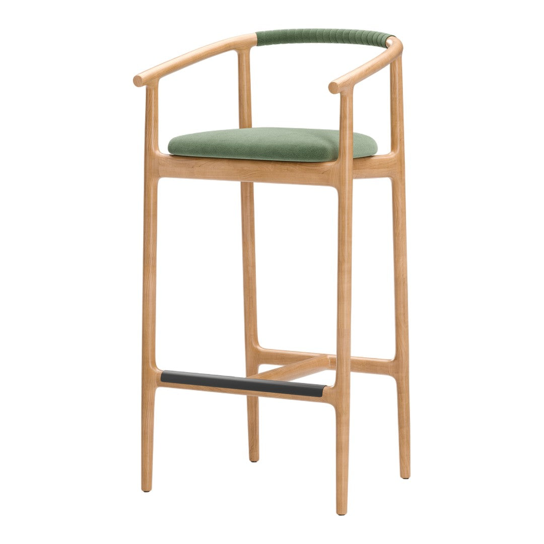 Stylish wooden bar stool with a natural finish, featuring a soft olive green cushion and a sleek black footrest.