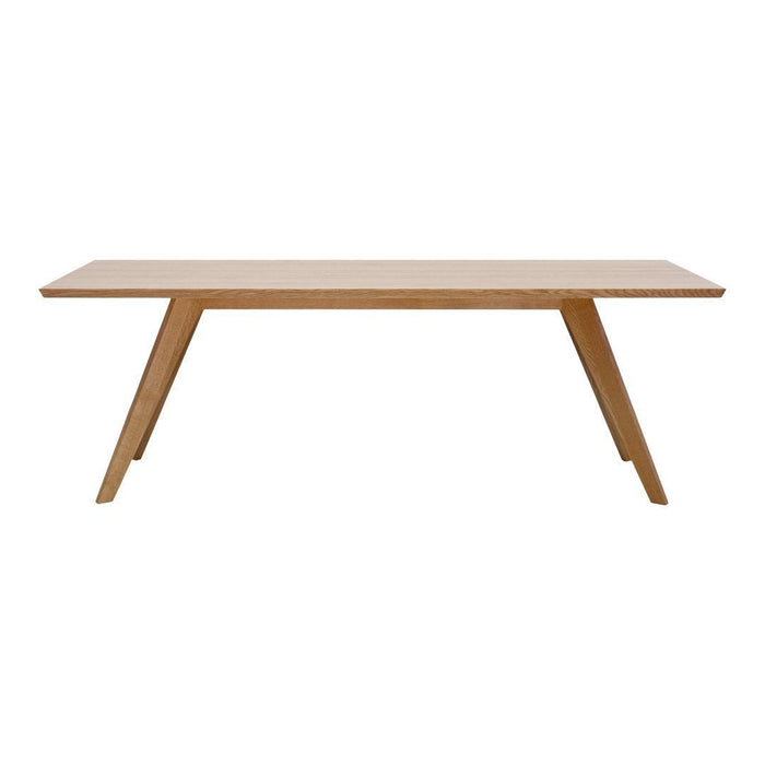 Light oak rectangular dining table with smooth surface and modern angled legs. Perfect for contemporary interiors.