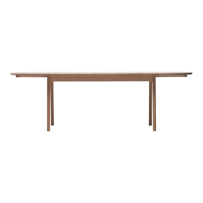 Light wood dining table with a smooth finish and clean, minimalist lines. Ideal for modern interiors.