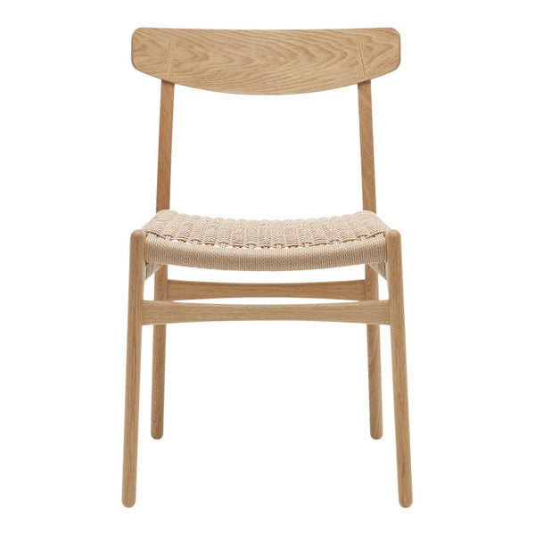 Light oak wood chair with a woven natural fiber seat and simple minimalist design.