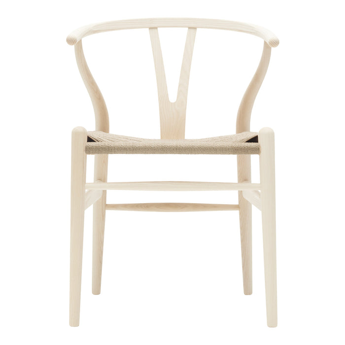 Light wood chair with a minimalist design, featuring a natural finish and unique Y-shaped backrest.