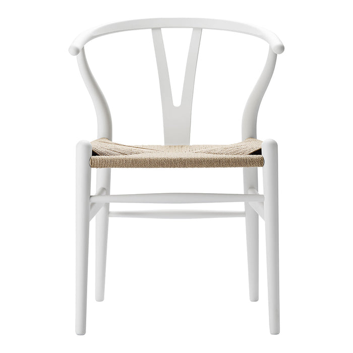 White wooden chair with a natural woven seat, featuring a minimalist design and elegant curves.