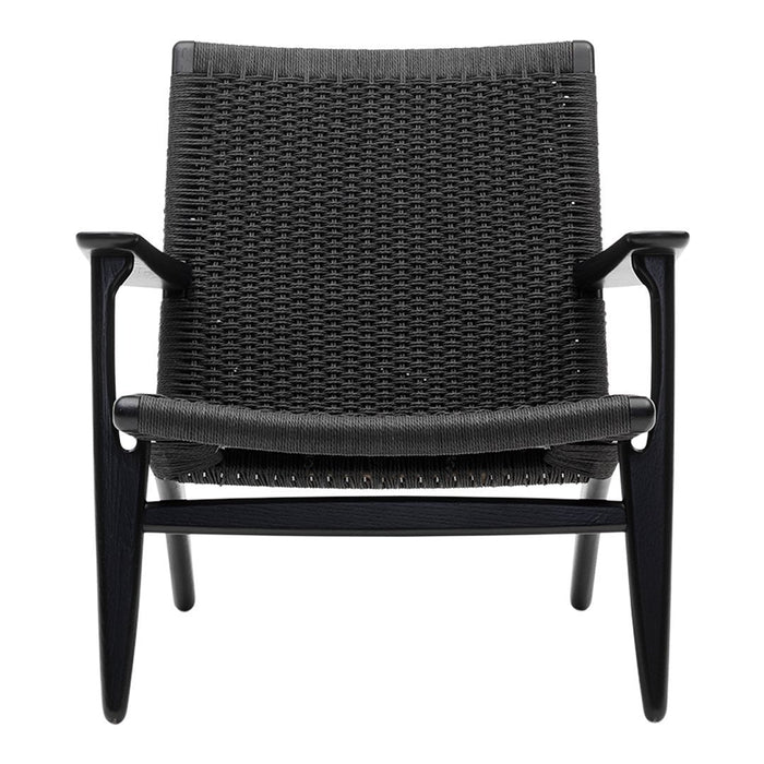 Black woven chair with a sleek design and contrasting light gray cushions, featuring a minimalist pattern.