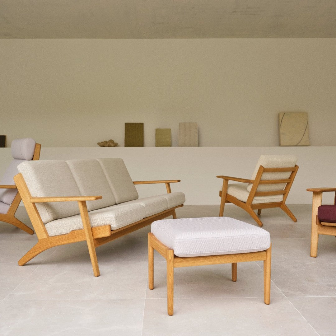 "Light beige upholstery with wooden frames, complementary patterns in soft neutral tones and subtle textures."