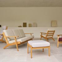 "Light beige upholstery with wooden frames, complementary patterns in soft neutral tones and subtle textures."