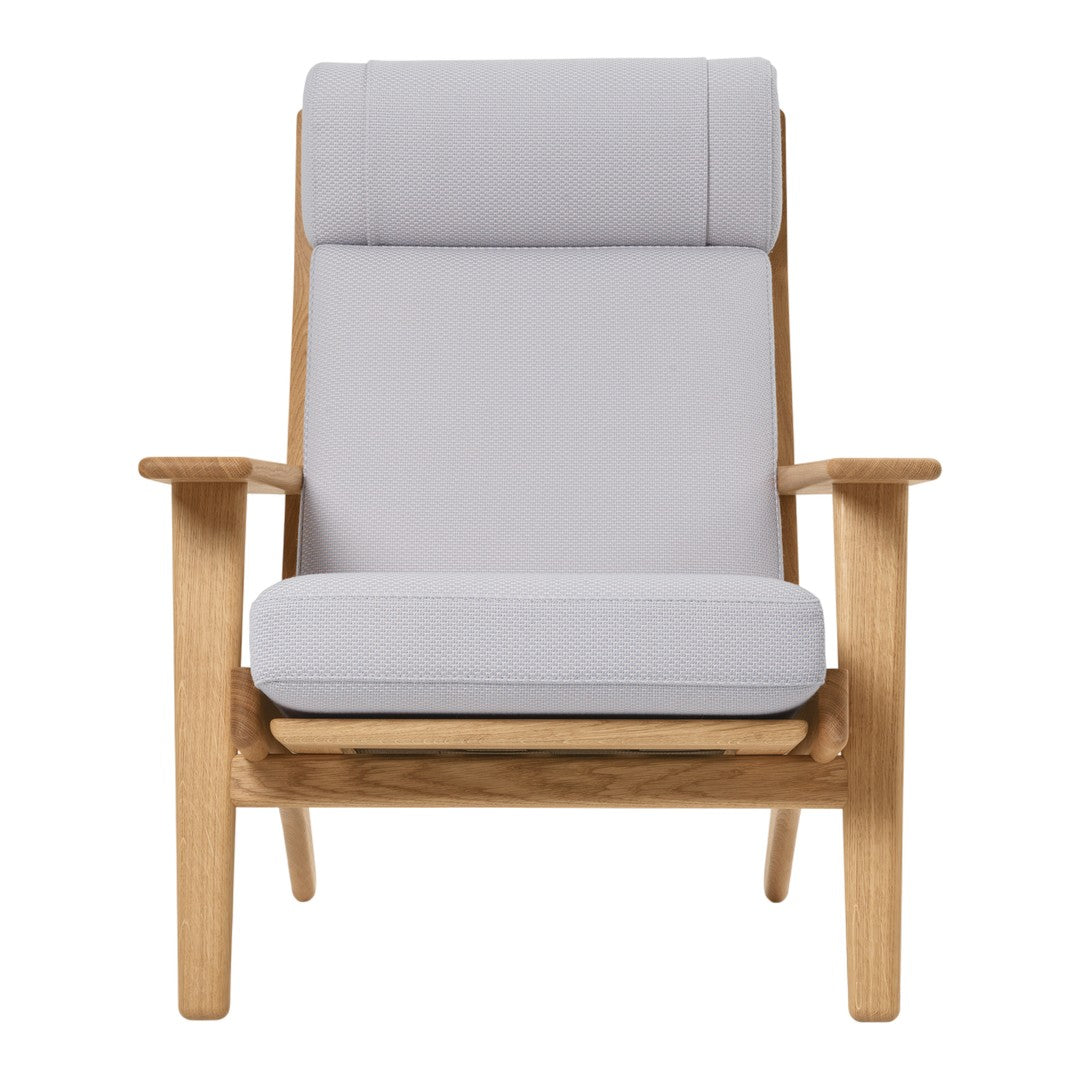 Light grey upholstered armchair with a smooth texture and natural wood frame, featuring a minimalist design.