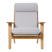 Light grey upholstered armchair with a smooth texture and natural wood frame, featuring a minimalist design.