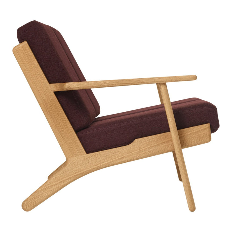 Stylish maroon cushion with light natural wood frame, featuring a minimalist design. Perfect for modern decor.