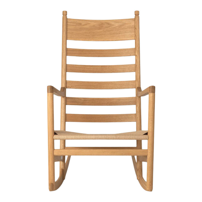Natural oak rocking chair with a sleek, minimalist design and horizontal slat pattern. Perfect for a cozy aesthetic.