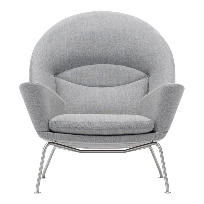 Gray upholstered chair with a modern, rounded design and sleek metal legs. Soft, smooth texture and minimalist aesthetic.