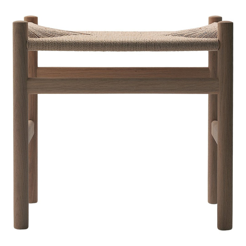 Natural wood stool with a light beige woven seat, showcasing a minimalist design and earthy tones.