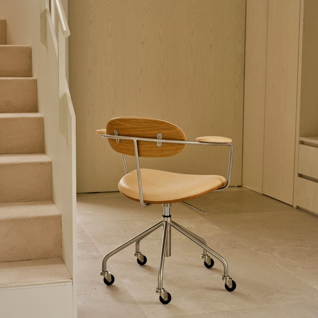 Wooden office chair with a natural finish, featuring a sleek design and chrome accents against a minimalist background.