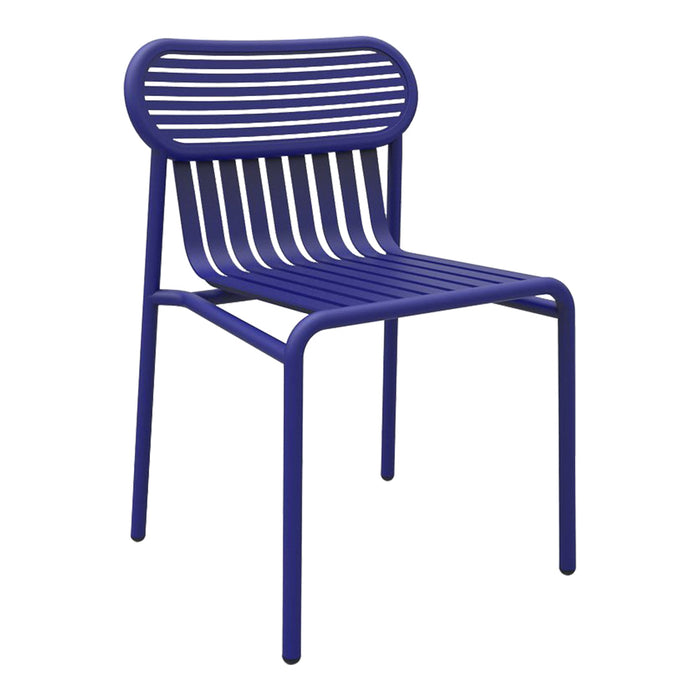 Vibrant purple chair with a sleek striped design, perfect for modern indoor or outdoor spaces.