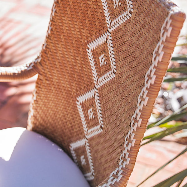 Natural woven texture in warm brown with white geometric patterns and intricate border detailing. Perfect for home decor.