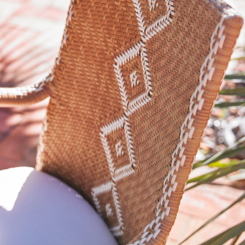 Natural woven texture in warm brown with white geometric patterns and intricate border detailing. Perfect for home decor.
