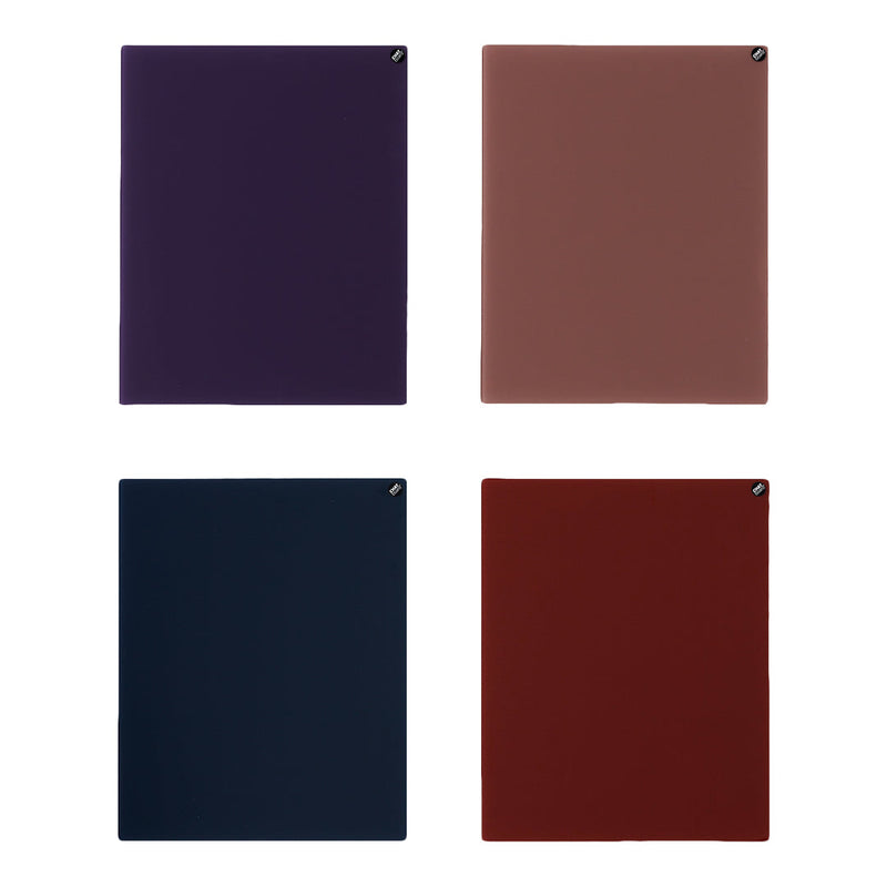 "Set of four A5 notebooks in deep purple, warm taupe, navy blue, and rich burgundy colors, showcasing smooth finishes."