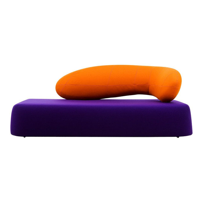 Vibrant purple sofa with a bold orange cushion, featuring a modern, minimalist design. Perfect for contemporary decor.
