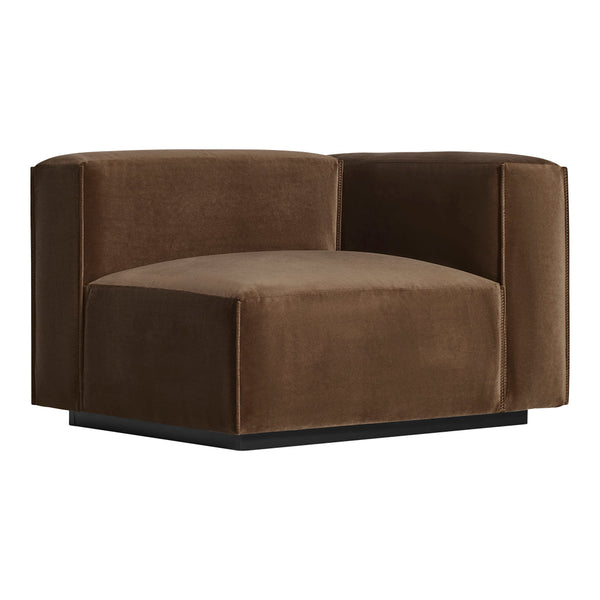 Brown velvet accent chair with a minimalist design and smooth texture, featuring a sleek black base.