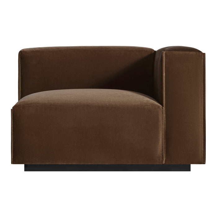 Brown velvet armchair with a minimalist design and smooth, sleek finish. Perfect for modern interiors.