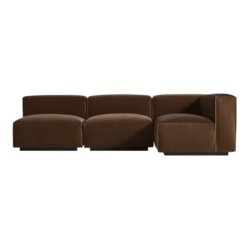 Brown velvet modular sofa with a smooth, luxurious texture and contemporary, geometric design.