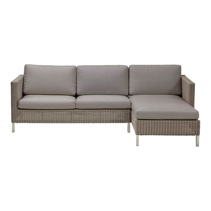 Gray outdoor sectional sofa with sleek lines and light woven rattan pattern. Comfortable, modern design for patio seating.