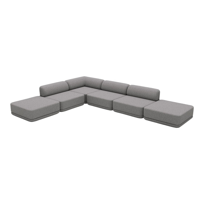 "Modern sectional sofa in light gray upholstery, featuring sleek lines and a minimalist design."