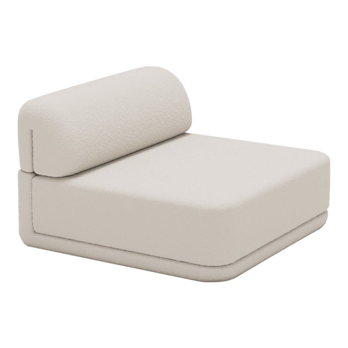 Beige modular lounge chair with smooth, minimalist design and subtle texture. Perfect for modern decor.
