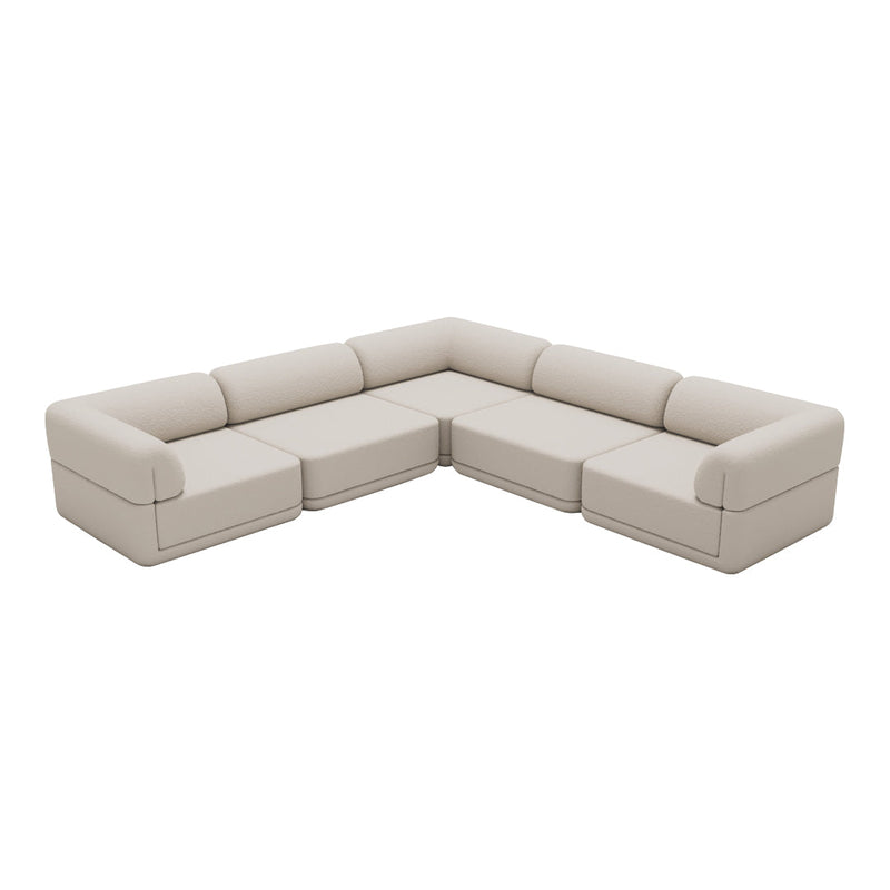 Beige sectional sofa with smooth, minimalistic design and no visible patterns, perfect for modern living spaces.