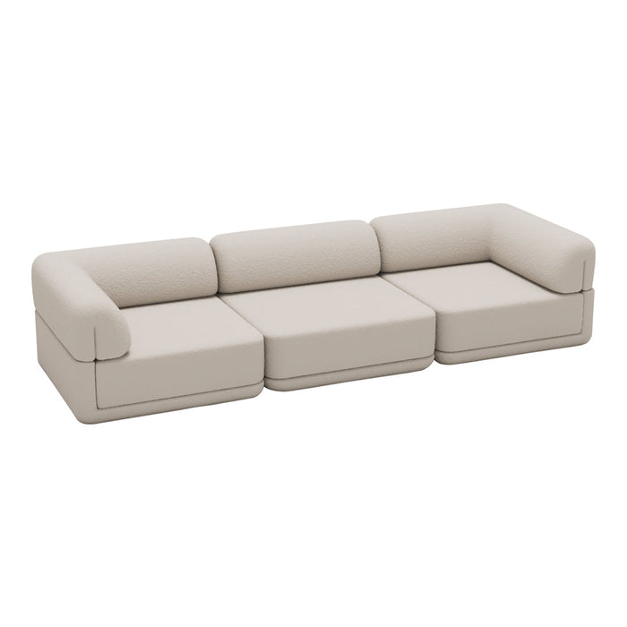 Beige modular sofa with smooth upholstery and minimalist design for modern interiors.