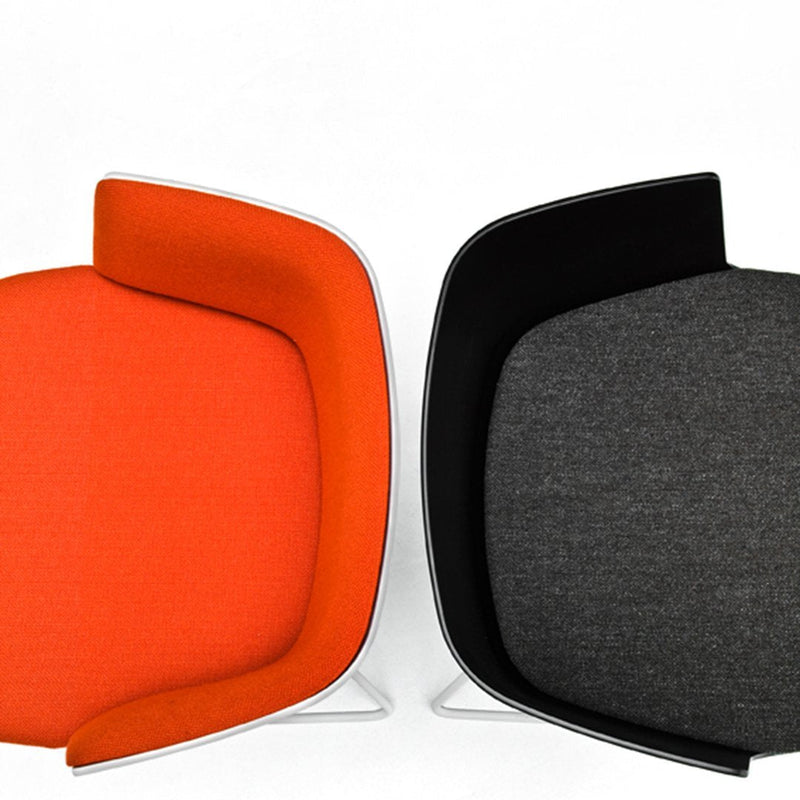 "Orange and charcoal gray upholstered chairs with sleek, modern designs and contrasting colors."
