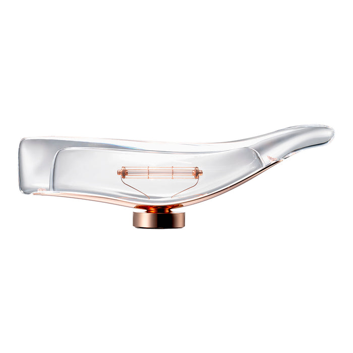 Clear glass lamp with a sleek, curved design and a rose gold base, showcasing a modern, minimalist aesthetic.