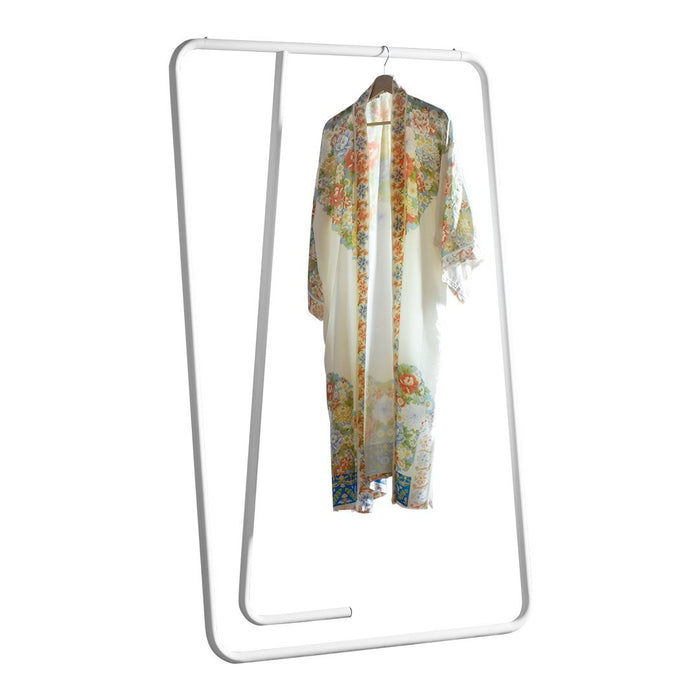 Floral patterned kimono in soft cream with vibrant multicolored flowers and delicate fringed edges.
