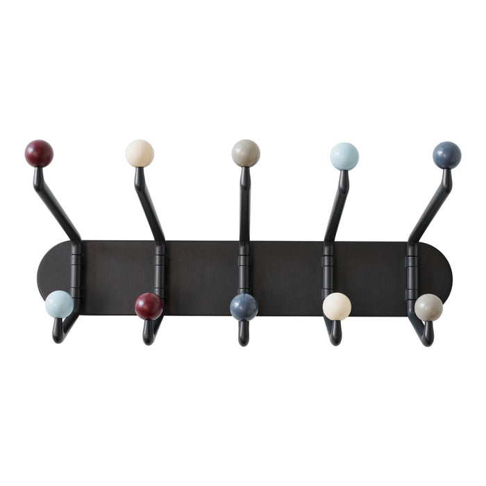 Multi-colored wall hooks featuring round knobs in red, blue, cream, and black on a sleek black backdrop.