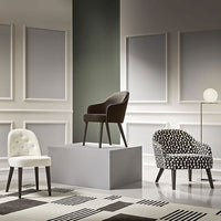 Stylish chairs in black, white, and polka dot patterns, showcased in an elegant contemporary setting.