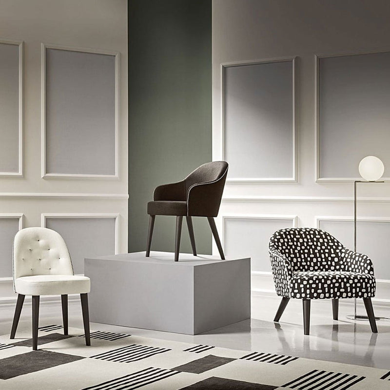 Stylish chairs in black, white, and polka dot patterns, showcased in an elegant contemporary setting.
