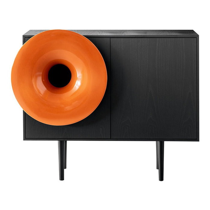 Black storage cabinet with a vibrant orange horn-shaped speaker. Sleek design with smooth wood texture.