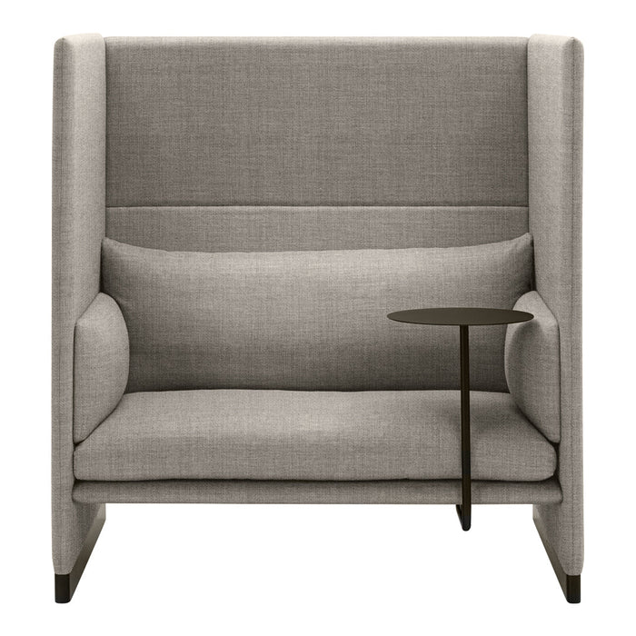 Gray upholstered armchair with a minimalist design, featuring a sleek black side table and subtle textured fabric.