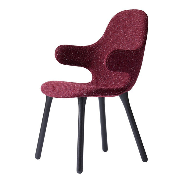 Red textured chair with a sculpted seat and black wooden legs, adding a bold statement to any space.