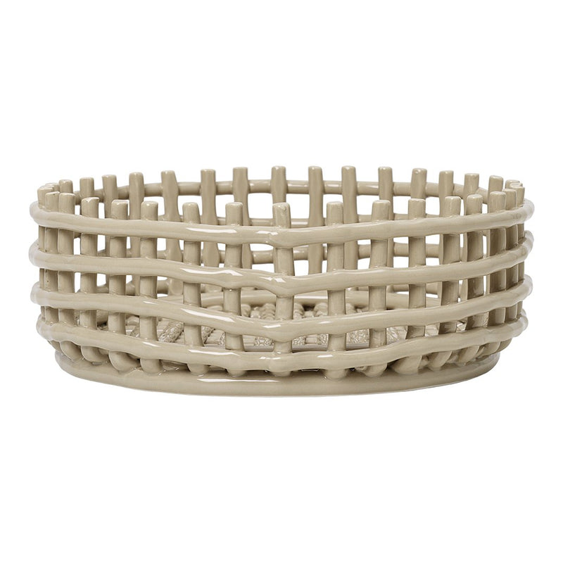 Beige woven basket with a textured, layered design and open pattern, perfect for storage and decor accents.