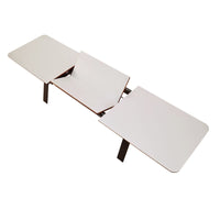 White multi-functional table with sleek, smooth surfaces and a minimalist design. Perfect for modern decor.